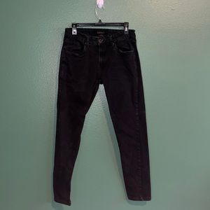 Faded distressed black denim